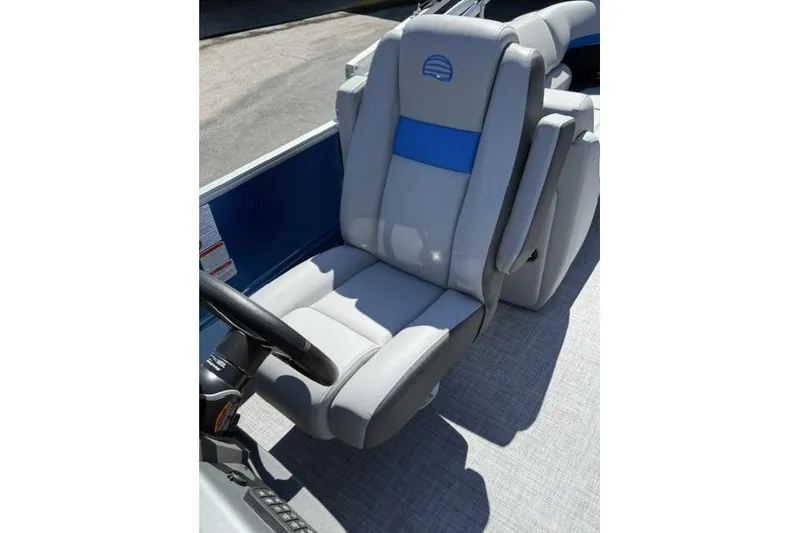 Slide: The Image of Captain's chair on 2026 Sun Tracker Party Barge 24 XP3, featuring gray and blue upholstery. - 12