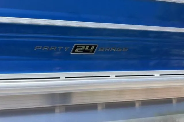Slide: The Image of 2026 Sun Tracker Party Barge 24 XP3, blue exterior with model emblem. - 5