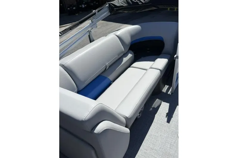 Slide: The Image of 2026 Sun Tracker Party Barge 24 XP3, featuring luxurious gray seating. - 8