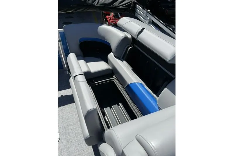 Slide: The Image of 2026 Sun Tracker Party Barge 24 XP3 interior seating with storage compartments. - 9