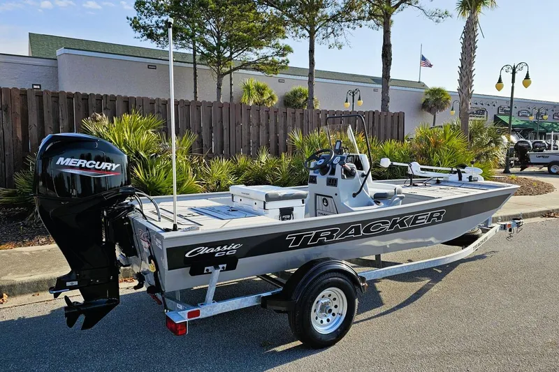 Slide: The Image of 2026 Tracker Bass Tracker Classic CC boat with Mercury engine on trailer. - 2