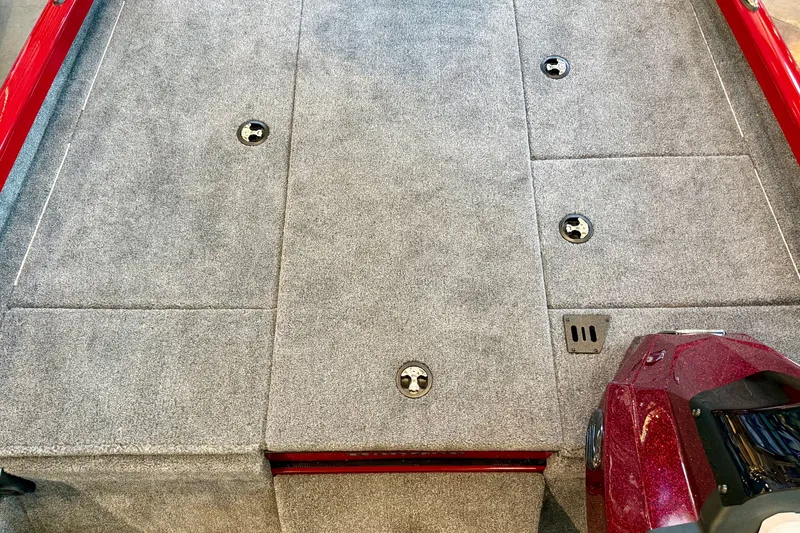 Slide: The Image of Carpeted deck of a 2026 Ranger RT188P boat with storage compartments. - 13