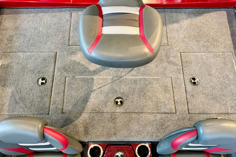 Slide: The Image of 2026 Ranger RT188P boat interior with gray and red seating, carpeted flooring, and storage compartments. - 19