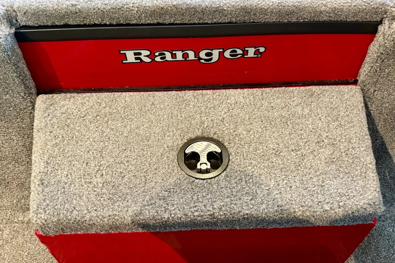 Slide: The Image of 2026 Ranger RT188P boat interior with red and gray carpeted storage compartment. - 17