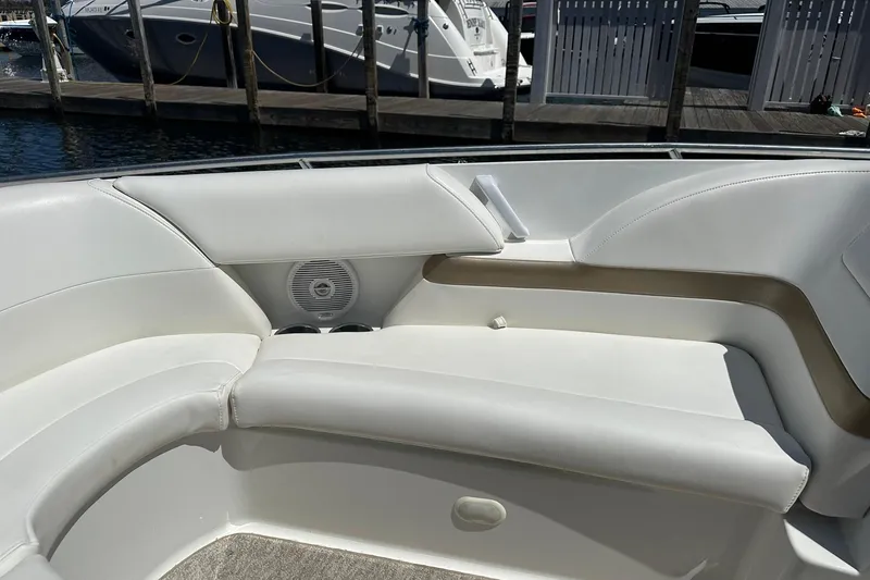 Slide: The Image of 2004 Formula 260 Bowrider boat interior with white seating and speaker. - 14
