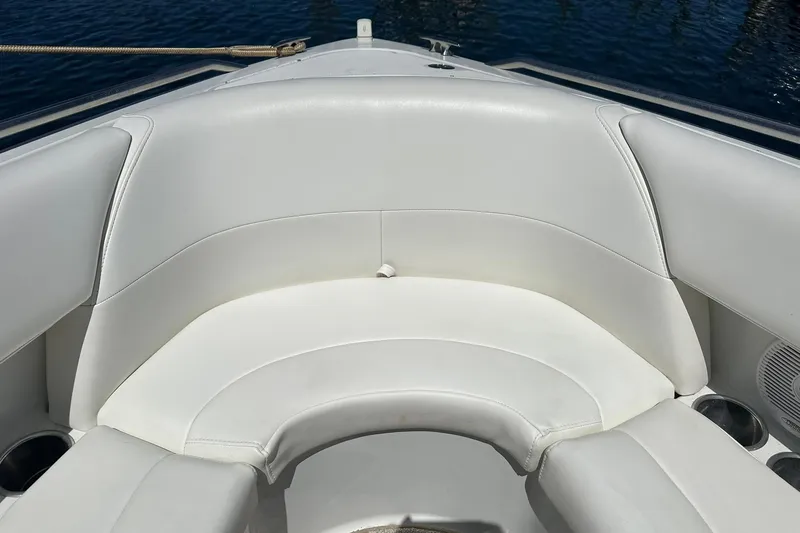 Slide: The Image of 2004 Formula 260 Bowrider boat interior with white cushioned seating. - 15