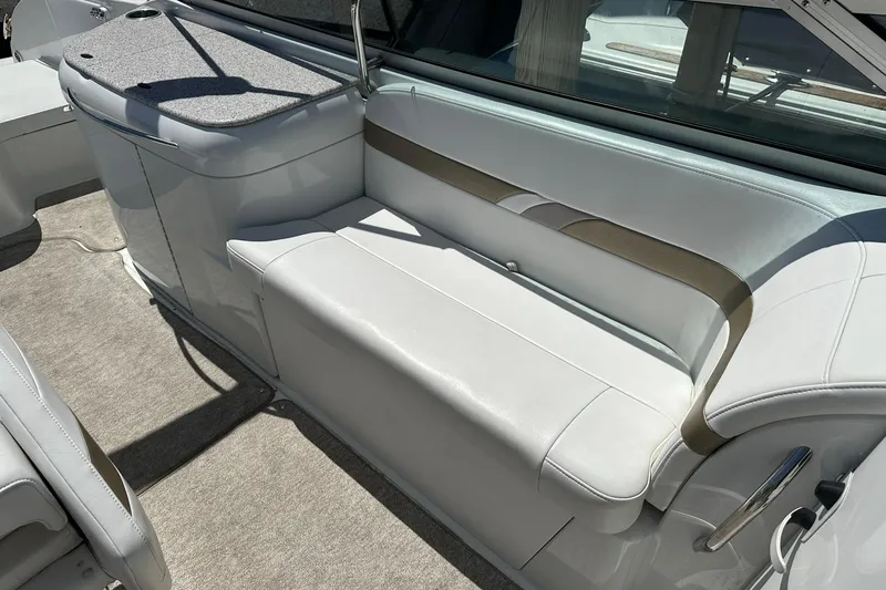 Slide: The Image of 2004 Formula 260 Bowrider interior with white seating and carpeted flooring. - 18