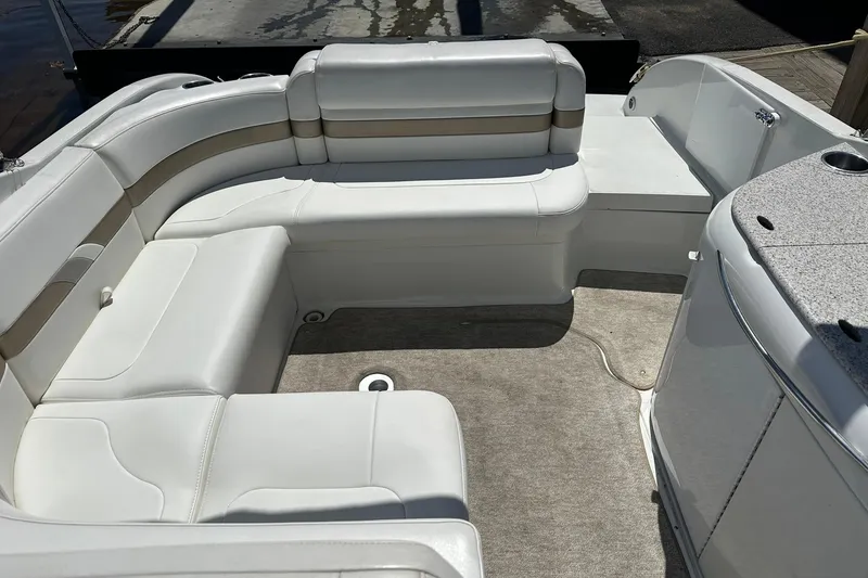 Slide: The Image of 2004 Formula 260 Bowrider interior with white seating and carpeted floor. - 19