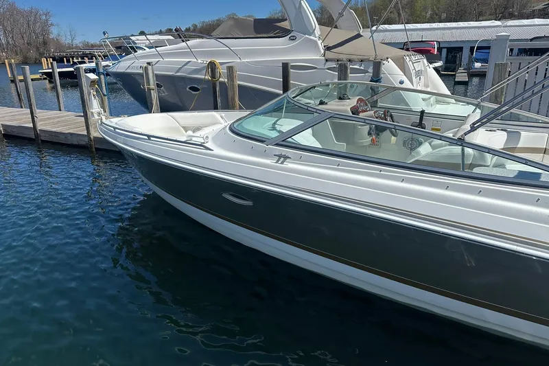 Slide: The Image of 2004 Formula 260 Bowrider docked at marina, clear blue water, sunny day. - 3