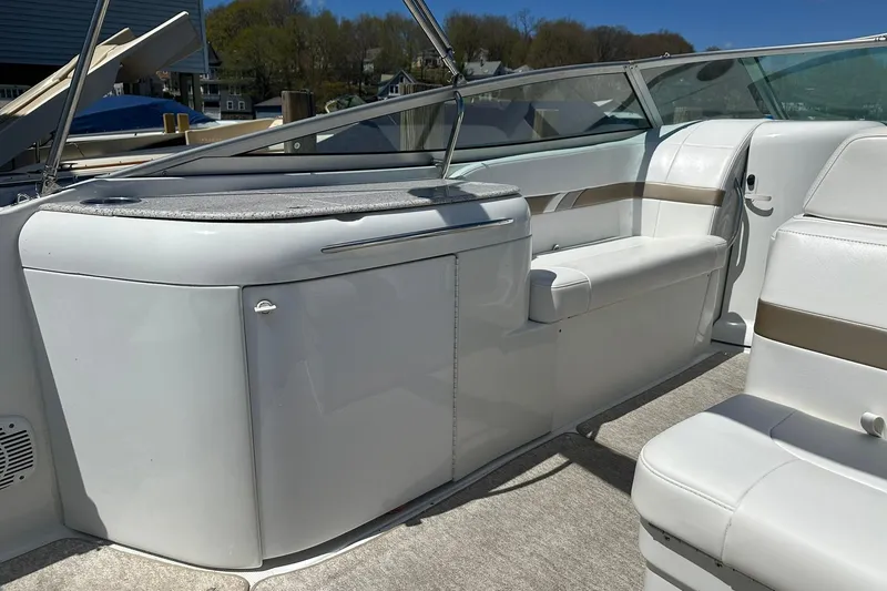 Slide: The Image of 2004 Formula 260 Bowrider interior with white seating and sleek design. - 7