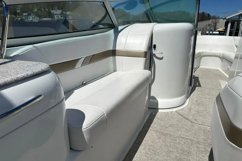 Slide: The Image of 2004 Formula 260 Bowrider interior with white seating and sleek design. - 8