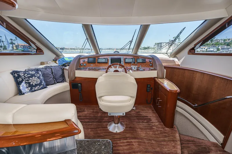 Slide: The Image of Luxurious interior of a 2005 Marquis 65 yacht with plush seating and modern helm. - 54