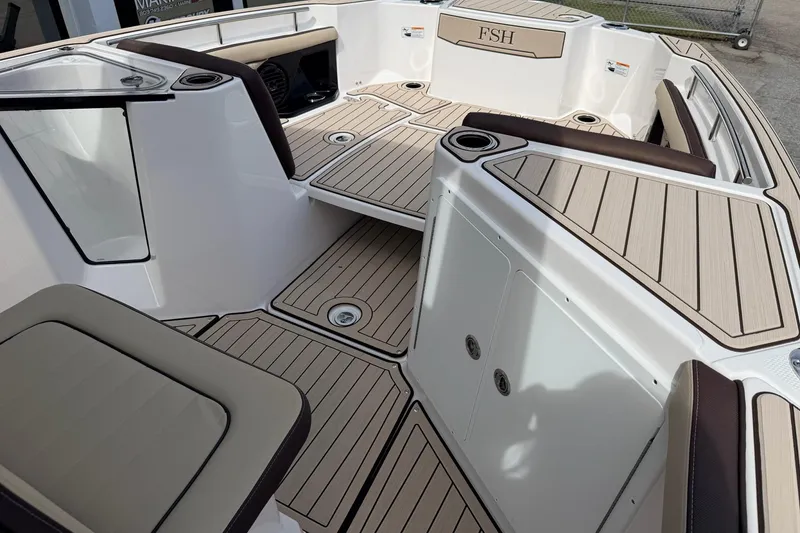 Slide: The Image of 2026 Yamaha Boats 255 FSH Sport H interior with sleek seating and modern design. - 14
