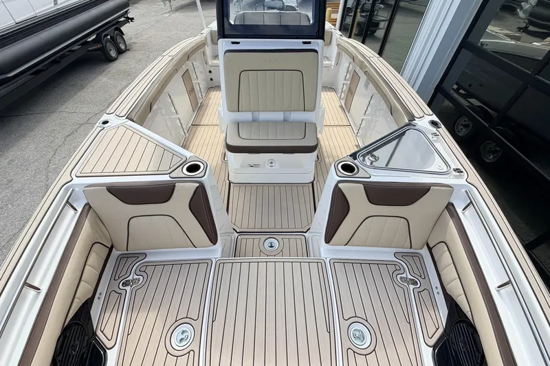 Slide: The Image of 2026 Yamaha Boats 255 FSH Sport H interior with sleek seating and modern design. - 21
