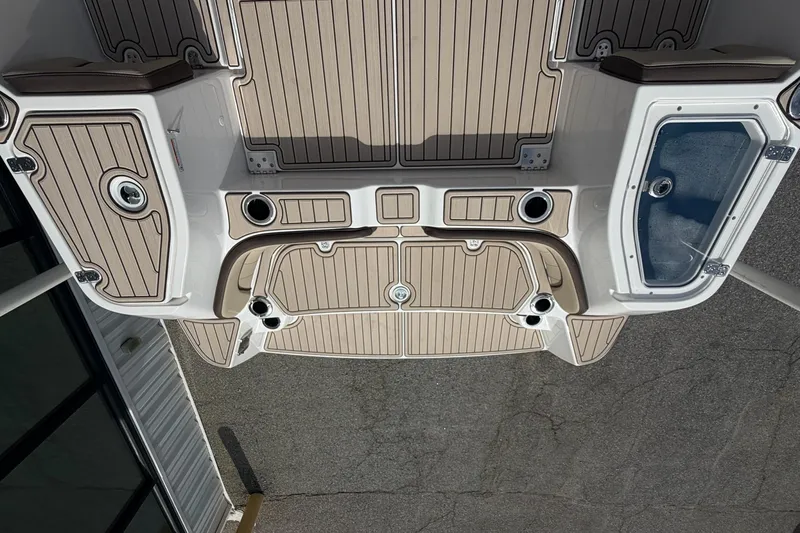 Slide: The Image of 2026 Yamaha Boats 255 FSH Sport H deck with beige and white detailing. - 3