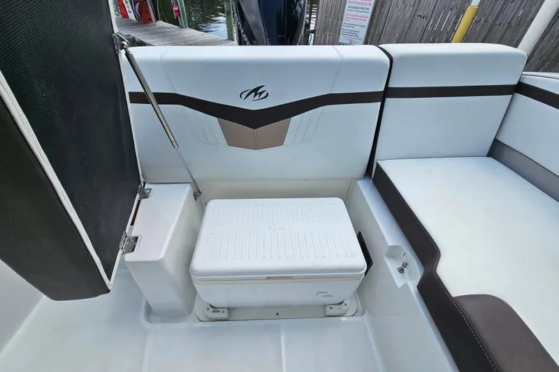 Slide: The Image of 2020 Monterey M-225 boat interior with seating and storage compartment. - 16