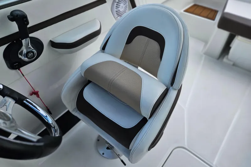 Slide: The Image of Captain's seat in a 2020 Monterey M-225 boat, featuring sleek design and comfortable upholstery. - 21
