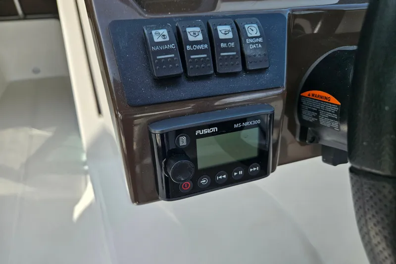 Slide: The Image of Control panel of a 2020 Monterey M-225 boat with Fusion MS-NRX300 stereo system. - 31