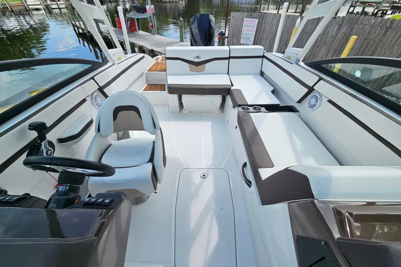 Slide: The Image of Interior of a 2020 Monterey M-225 boat with sleek seating and modern design. - 9