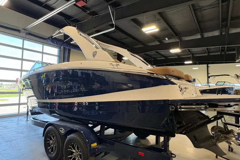 The Image of 2026 Regal LS6 boat in showroom, featuring sleek design and modern amenities. - 1