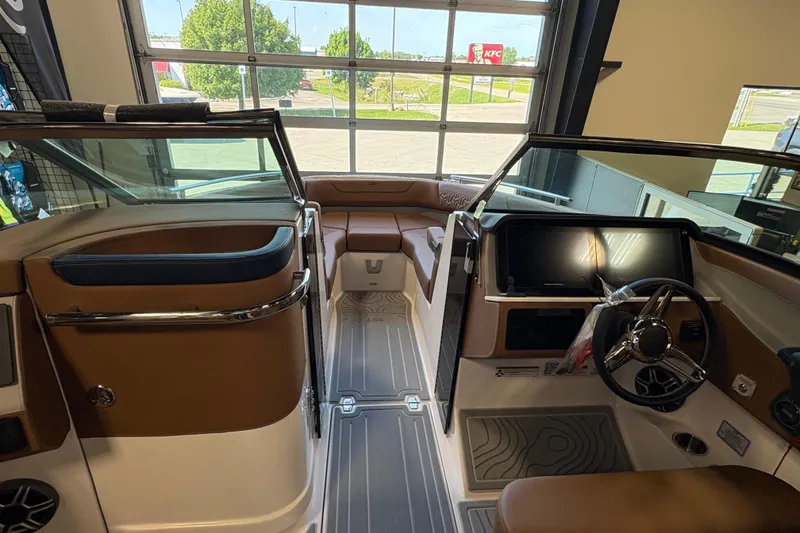 Slide: The Image of Interior view of a 2026 Regal LS6 boat, featuring sleek design and modern controls. - 12