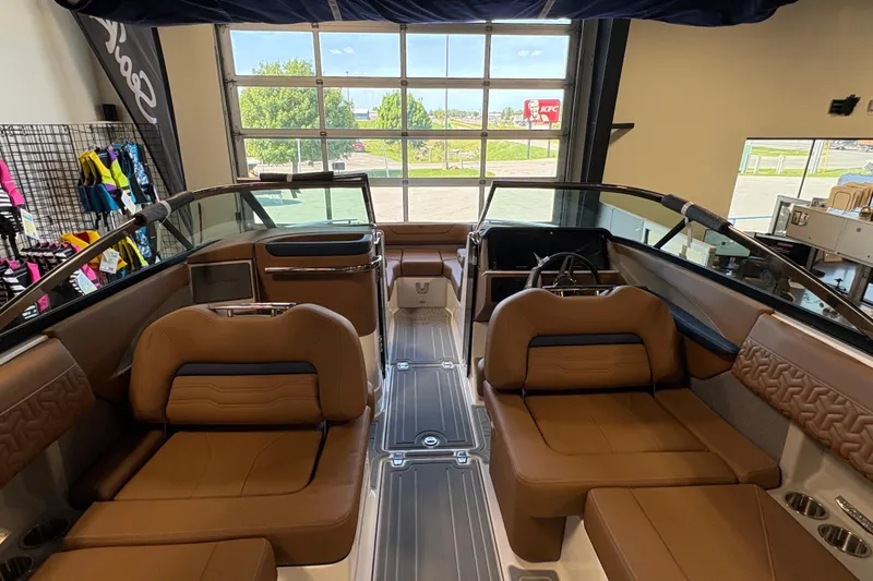 Slide: The Image of Luxurious interior of 2026 Regal LS6 boat with brown leather seating and modern design. - 14