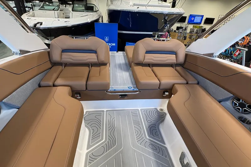 Slide: The Image of Luxurious interior of 2026 Regal LS6 boat with brown leather seating and modern design. - 15