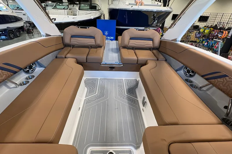 Slide: The Image of Luxurious interior of 2026 Regal LS6 boat with brown leather seating and modern design. - 17