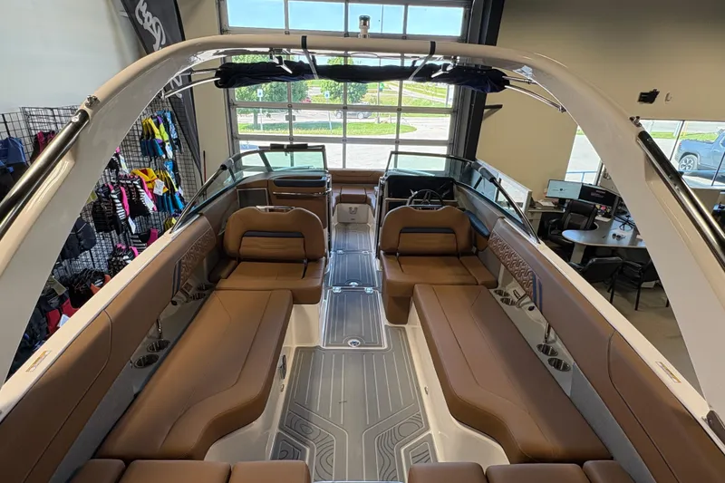 Slide: The Image of Luxurious interior of 2026 Regal LS6 boat with brown seating and modern design. - 18