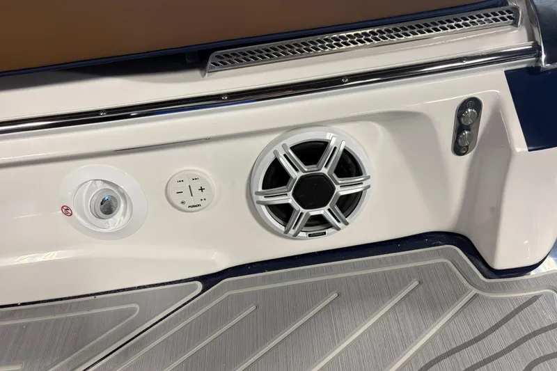 Slide: The Image of 2026 Regal LS6 boat audio system with speaker and control panel on deck. - 21