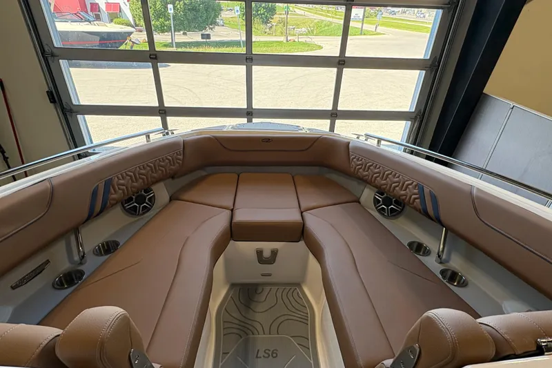 Slide: The Image of Luxurious interior of 2026 Regal LS6 boat with brown leather seating and modern design. - 3