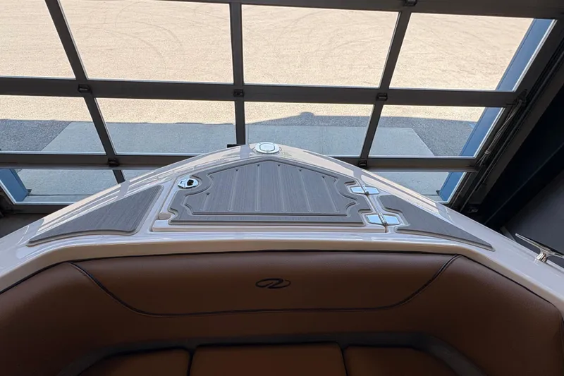 Slide: The Image of 2026 Regal LS6 boat interior, featuring sleek design and premium materials in a showroom setting. - 5
