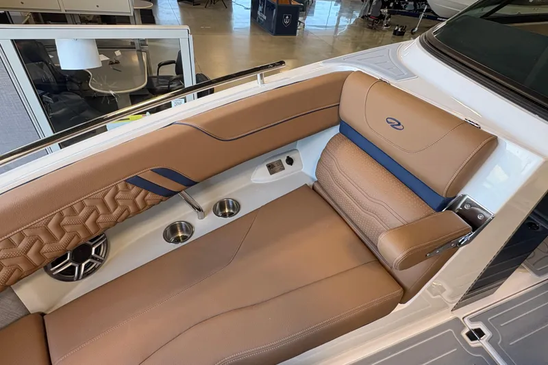 Slide: The Image of Luxurious interior of 2026 Regal LS6 boat with tan leather seating and cup holders. - 6