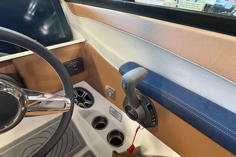 Slide: The Image of Interior of 2026 Regal LS6 boat showing steering wheel and control panel. - 7