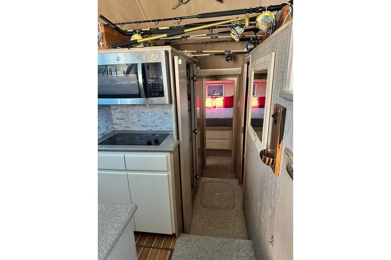 Slide: The Image of Bathroom interior of 1991 Hatteras 43 Convertible yacht with illuminated mirror and shower. - 11
