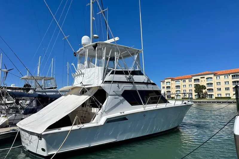 Slide: The Image of Helm of 1991 Hatteras 43 Convertible with Garmin navigation and Detroit Diesel controls. - 6