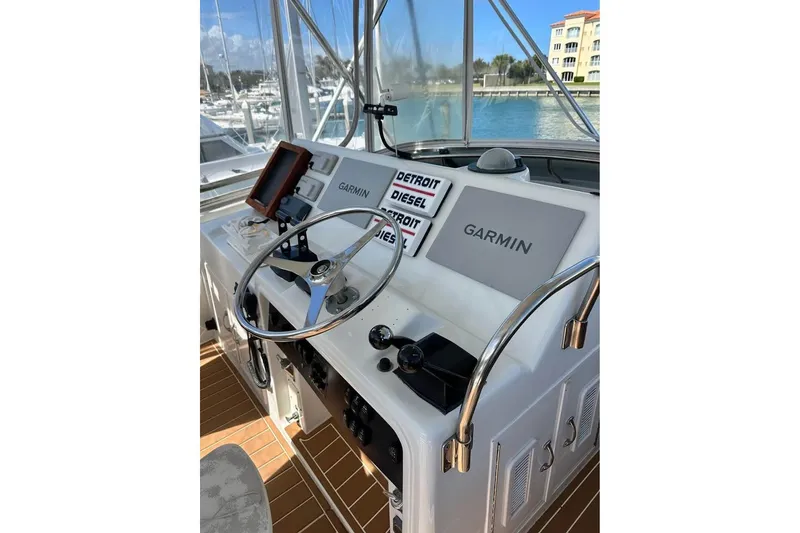 Slide: The Image of Interior of 1991 Hatteras 43 Convertible yacht with modern amenities and waterfront view. - 8
