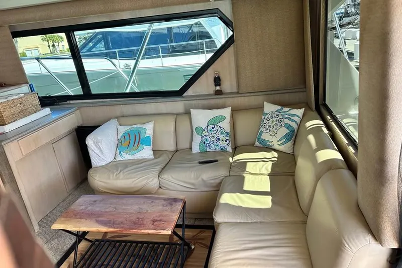 Slide: The Image of Interior of 1991 Hatteras 43 Convertible yacht with modern kitchen and fishing rods. - 9