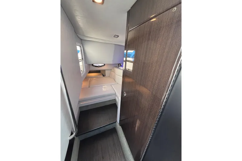 Slide: The Image of Interior cabin of 2018 Formula 330 Crossover Bowrider I/O, featuring sleek design and comfortable seating. - 15