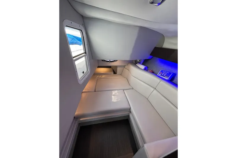 Slide: The Image of Interior of 2018 Formula 330 Crossover Bowrider I/O with sleek seating and ambient lighting. - 17