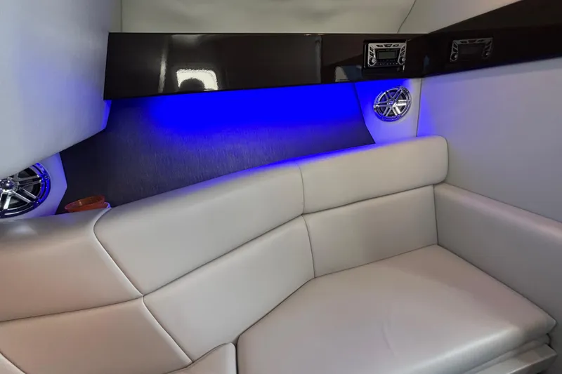 Slide: The Image of Luxurious interior of 2018 Formula 330 Crossover Bowrider with blue LED lighting and plush seating. - 18