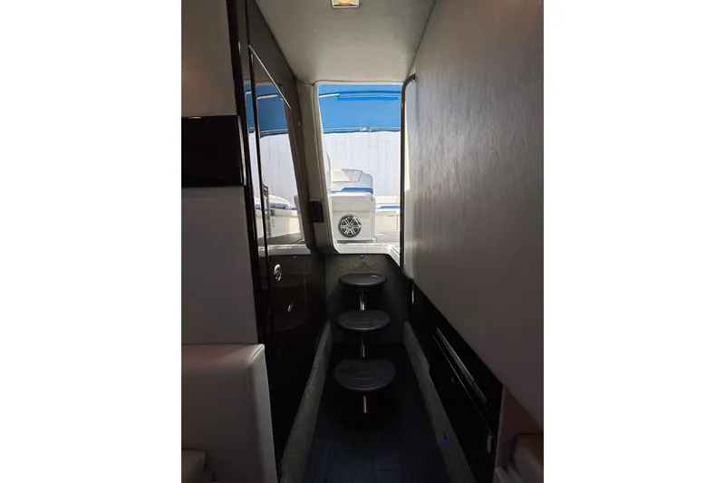 Slide: The Image of Interior view of 2018 Formula 330 Crossover Bowrider I/O with steps leading outside. - 19