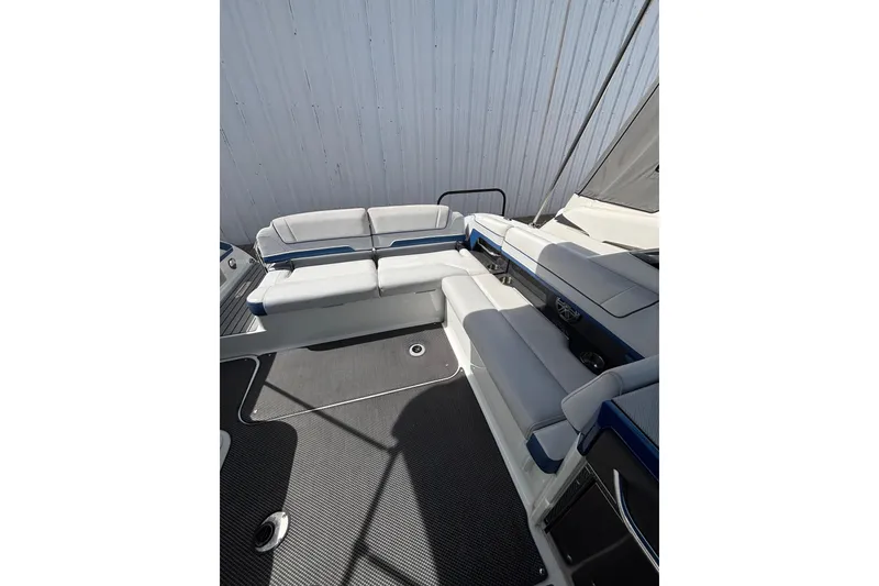 Slide: The Image of 2018 Formula 330 Crossover Bowrider I/O interior with spacious seating and sleek design. - 4