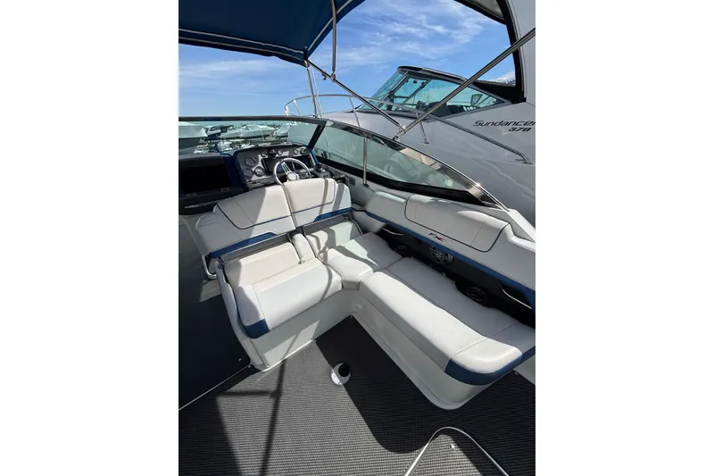Slide: The Image of 2018 Formula 330 Crossover Bowrider I/O interior with plush seating and modern dashboard. - 5