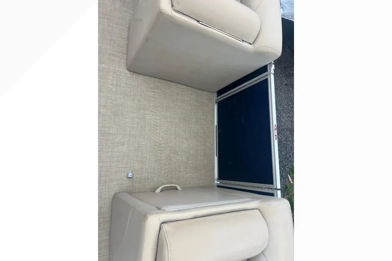 Slide: The Image of Beige seating on 2019 Harris Cruiser 210 boat, featuring a sleek design. - 25