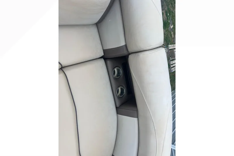 Slide: The Image of 2019 Harris Cruiser 210 boat seats with built-in cup holders, beige upholstery. - 36