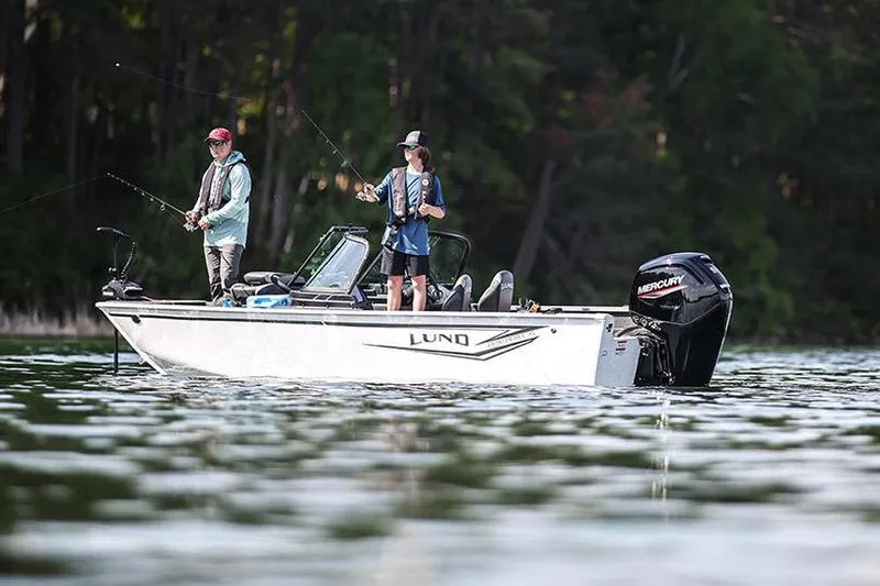 The Image of Manufacturer Provided Image: 2025 Lund 1650 Rebel XL Sport boat with two people fishing on a lake. - 0