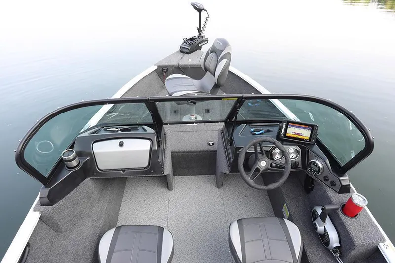 Slide: The Image of Manufacturer Provided Image: 2025 Lund 1650 Rebel XL Sport boat interior with steering console and seating. - 2