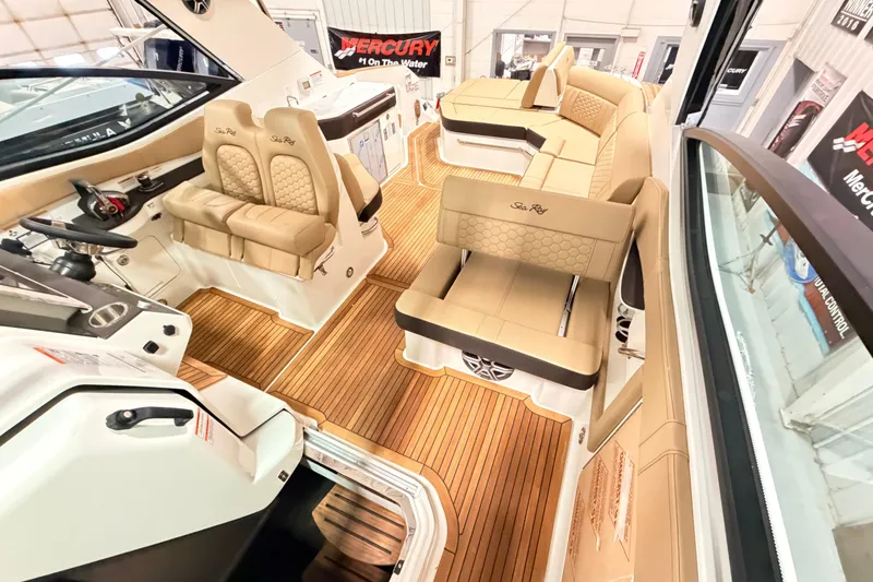 Slide: The Image of Luxurious interior of 2026 Sea Ray Sundancer 320 Coupe with elegant seating and wood flooring. - 14