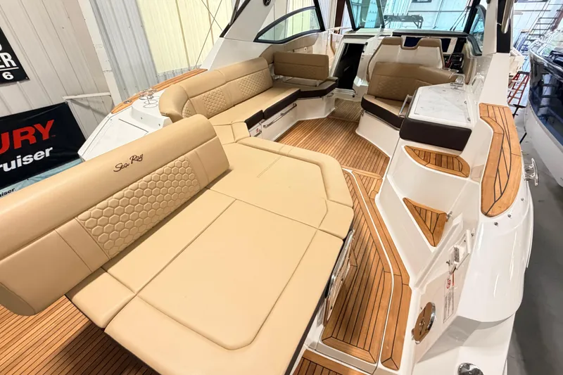 Slide: The Image of Luxurious interior of 2026 Sea Ray Sundancer 320 Coupe with elegant seating and wood accents. - 6